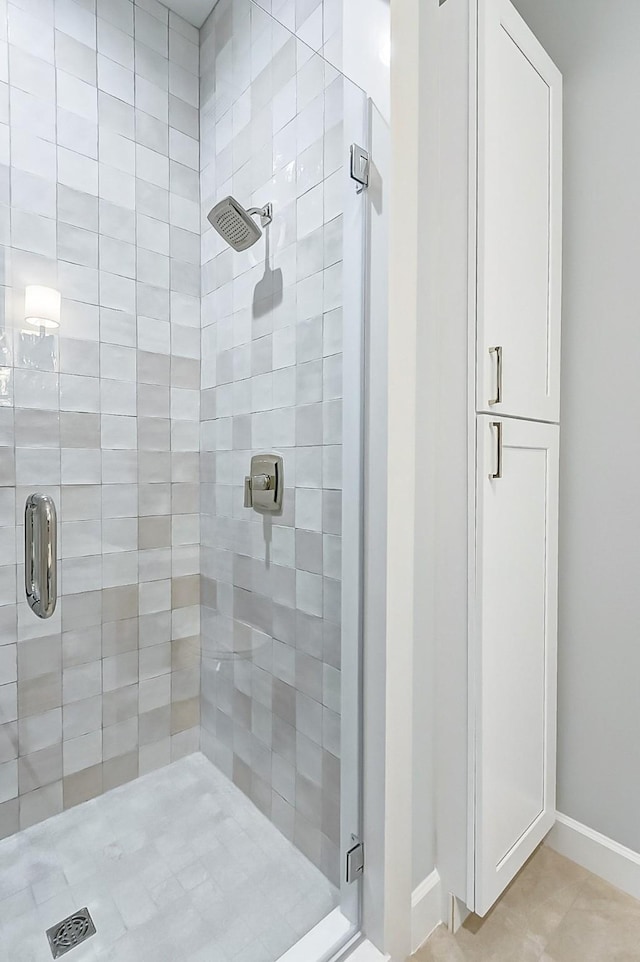 6522 Westview Dr, Houston, TX 77055 - bathroom featuring a stall shower and tile patterned flooring