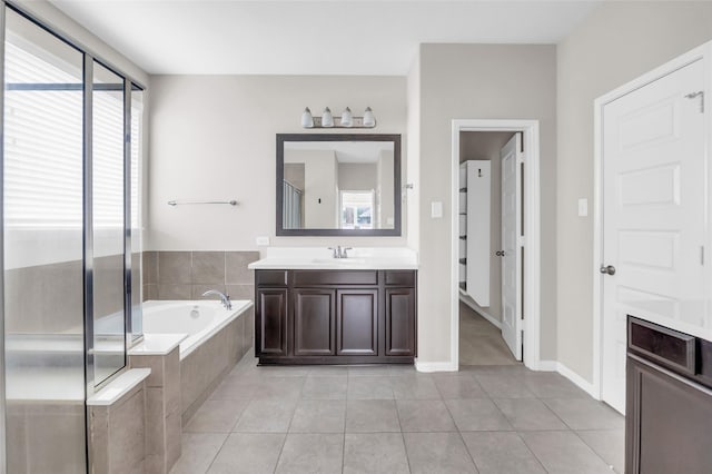 22519 Birch Ridge Meadow Dr, Spring, TX 77389 - bathroom with vanity, a bath, tile patterned flooring, and a shower stall