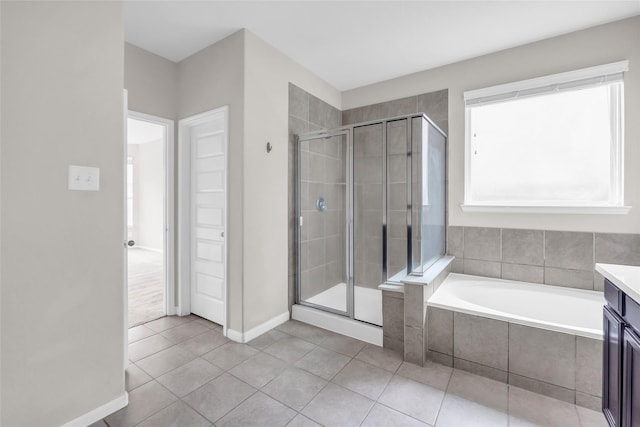 22519 Birch Ridge Meadow Dr, Spring, TX 77389 - full bathroom with a shower stall, tile patterned flooring, a bath, and vanity
