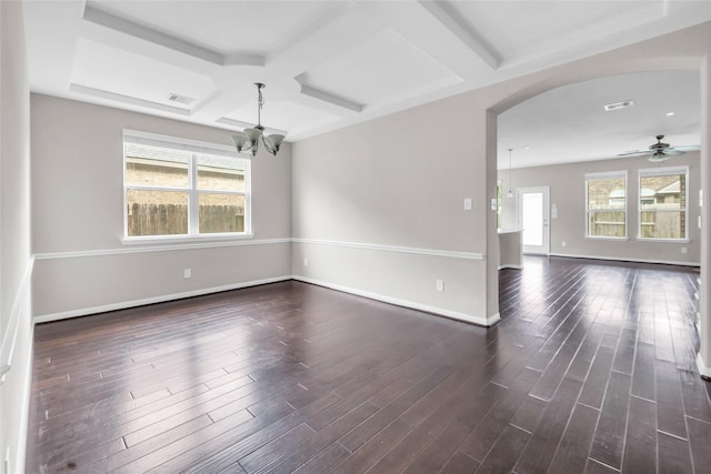 22519 Birch Ridge Meadow Dr, Spring, TX 77389 - spare room with a chandelier, arched walkways, coffered ceiling, dark wood-style flooring, and a ceiling fan