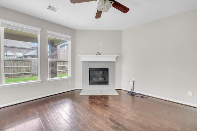22519 Birch Ridge Meadow Dr, Spring, TX 77389 - unfurnished living room with ceiling fan, a fireplace, and wood-type flooring