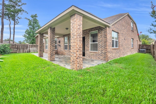 22519 Birch Ridge Meadow Dr, Spring, TX 77389 - rear view of property with brick siding, a fenced backyard, and a patio