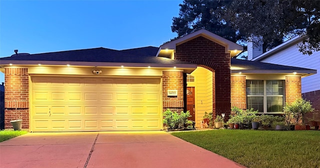 14022 Blackfoot Trail Run, Cypress, TX 77429 - view of front of house with brick siding, an attached garage, and driveway