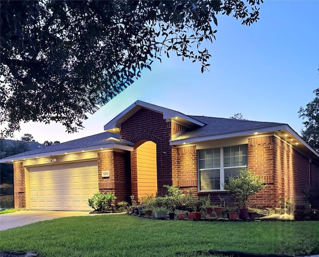 14022 Blackfoot Trail Run, Cypress, TX 77429 - view of front of home with brick siding, a garage, a front yard, and driveway