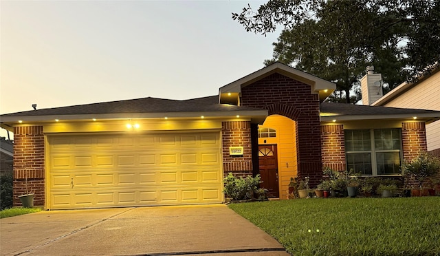 14022 Blackfoot Trail Run, Cypress, TX 77429 - view of front of home with brick siding, driveway, and an attached garage
