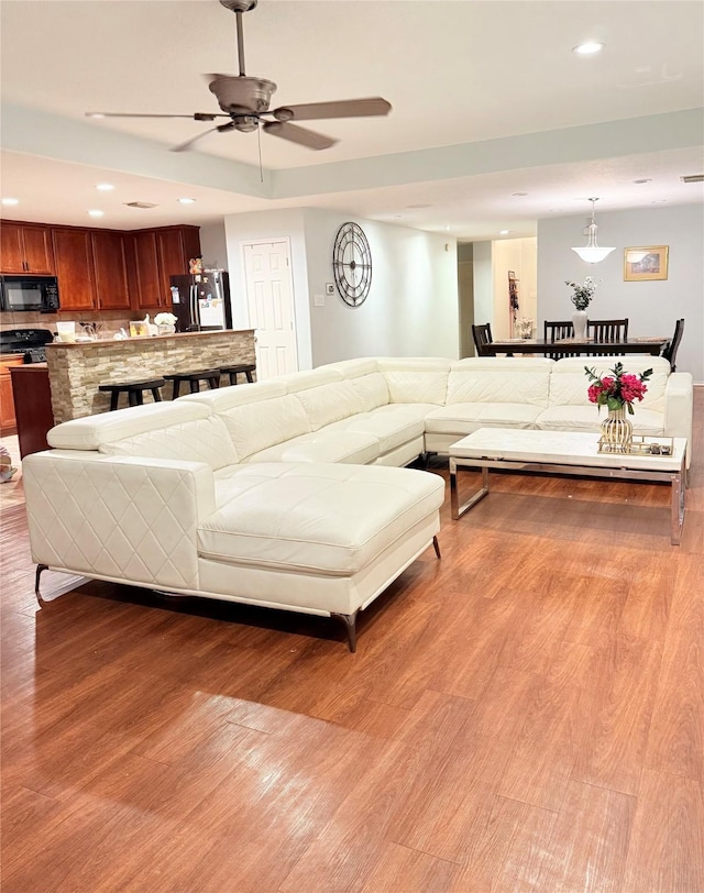 14022 Blackfoot Trail Run, Cypress, TX 77429 - living room featuring light wood-style floors, recessed lighting, and ceiling fan