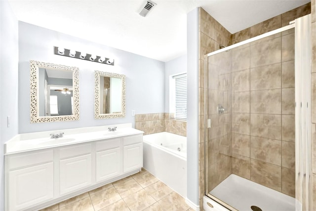 14022 Blackfoot Trail Run, Cypress, TX 77429 - bathroom featuring a bath, a stall shower, double vanity, and tile patterned floors