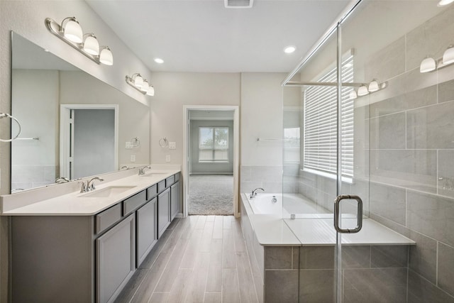 4805 Magnolia Springs Dr, Pearland, TX 77584 - full bath with double vanity, a bath, a stall shower, and recessed lighting