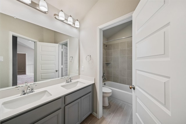 4805 Magnolia Springs Dr, Pearland, TX 77584 - bathroom featuring double vanity, wood finished floors, and bathtub / shower combination