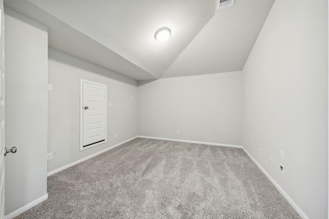 4805 Magnolia Springs Dr, Pearland, TX 77584 - additional living space with carpet floors and vaulted ceiling