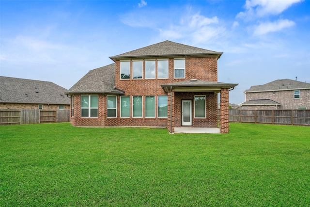 4805 Magnolia Springs Dr, Pearland, TX 77584 - rear view of house with a patio area, a fenced backyard, brick siding, and a shingled roof