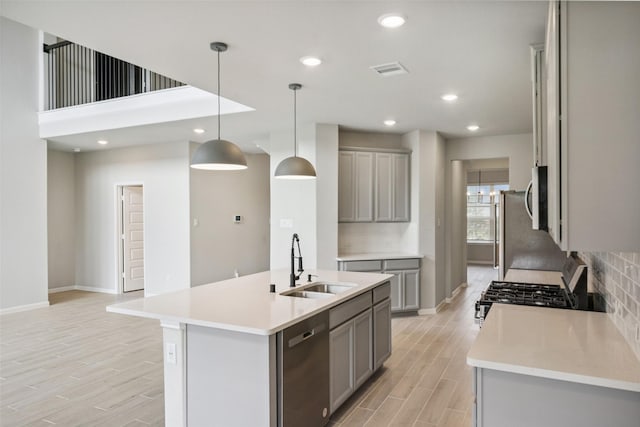 4805 Magnolia Springs Dr, Pearland, TX 77584 - kitchen with gray cabinets, dishwasher, range with gas stovetop, tasteful backsplash, and recessed lighting