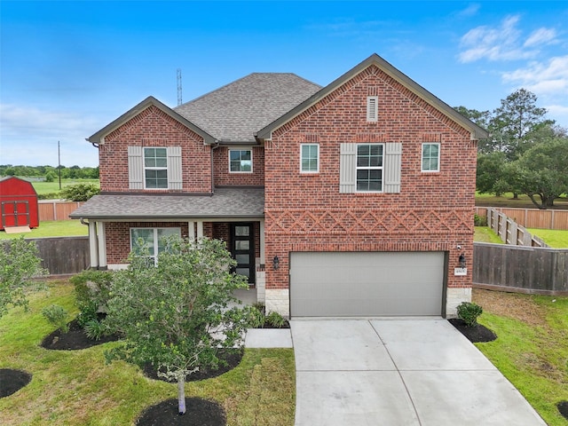 4805 Magnolia Springs Dr, Pearland, TX 77584 - traditional-style house featuring concrete driveway, an attached garage, brick siding, and a shingled roof