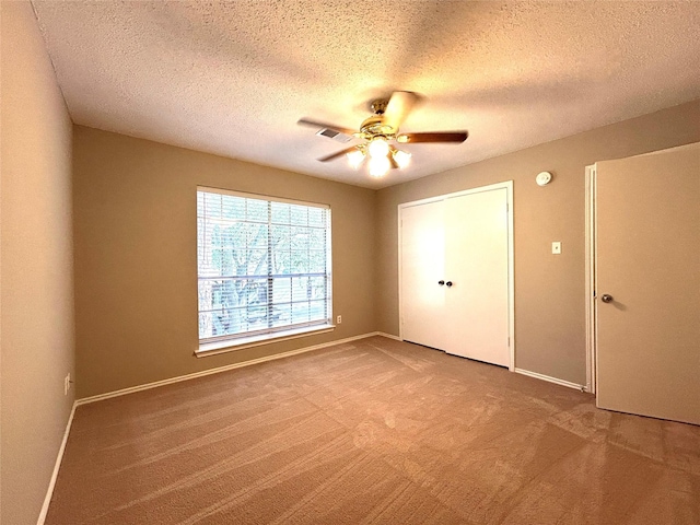 2802 Grants River Cir, Sugar Land, TX 77479 - unfurnished bedroom featuring carpet flooring, a textured ceiling, and ceiling fan