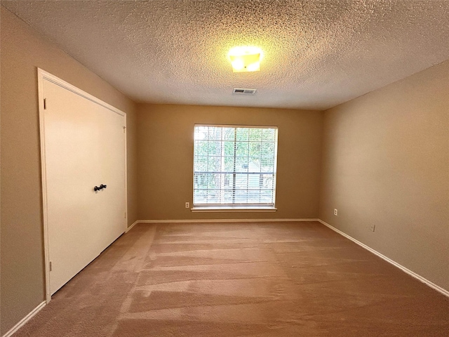 2802 Grants River Cir, Sugar Land, TX 77479 - carpeted empty room with baseboards and a textured ceiling