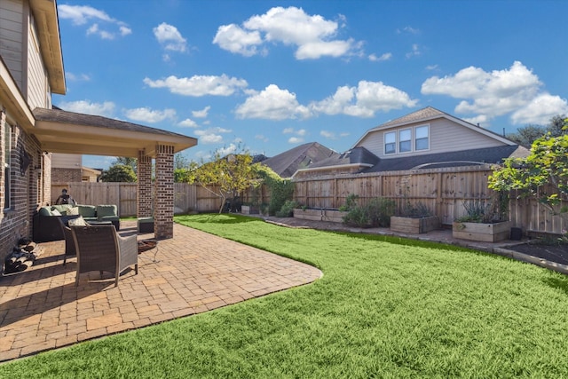 2209 Valley Blossum Ln, League City, TX 77573 - fenced backyard featuring a patio and a vegetable garden