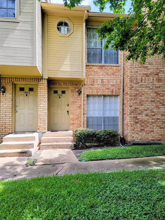 1515 Sandy Springs Rd Unit 1903, Houston, TX 77042 - doorway to property featuring brick siding