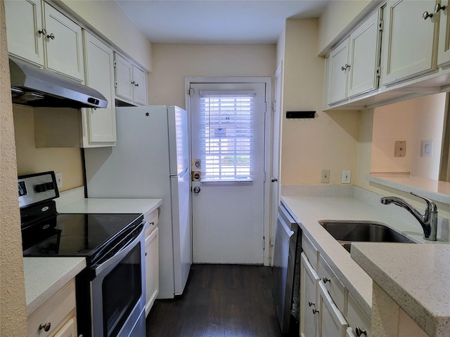 1515 Sandy Springs Rd Unit 1903, Houston, TX 77042 - kitchen with stainless steel appliances, under cabinet range hood, dark wood-style flooring, white cabinets, and light stone countertops