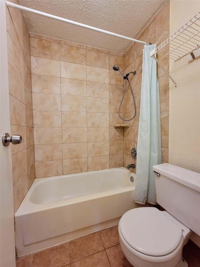 1515 Sandy Springs Rd Unit 1903, Houston, TX 77042 - bathroom featuring shower / bath combo, a textured ceiling, and tile patterned flooring