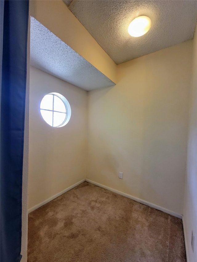 1515 Sandy Springs Rd Unit 1903, Houston, TX 77042 - carpeted spare room featuring a textured ceiling and baseboards