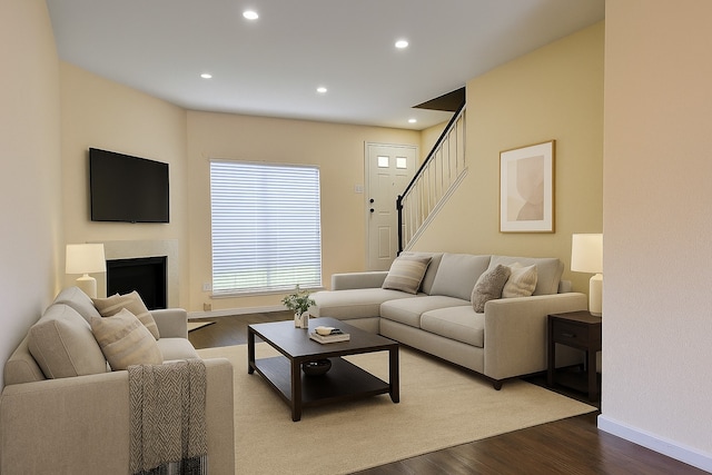 1515 Sandy Springs Rd Unit 1903, Houston, TX 77042 - living area with dark wood-style flooring, recessed lighting, stairway, and a fireplace