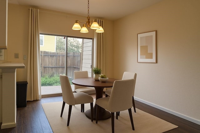 1515 Sandy Springs Rd Unit 1903, Houston, TX 77042 - dining space featuring healthy amount of natural light, a chandelier, and dark wood-style floors