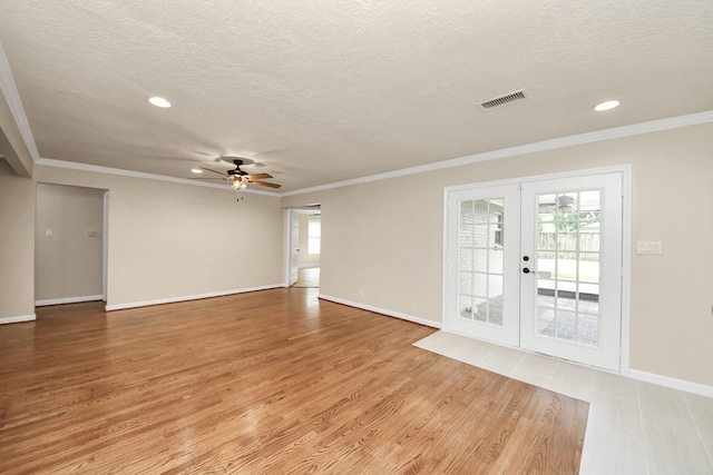 2215 Gardenia Dr, Houston, TX 77018 - empty room with french doors, a ceiling fan, a textured ceiling, light wood-type flooring, and recessed lighting