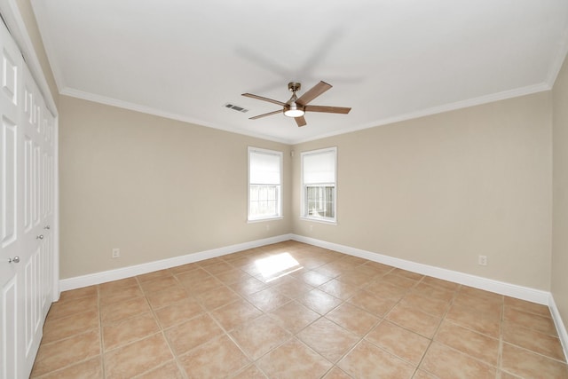 2215 Gardenia Dr, Houston, TX 77018 - unfurnished bedroom with a closet, ornamental molding, light tile patterned floors, and ceiling fan