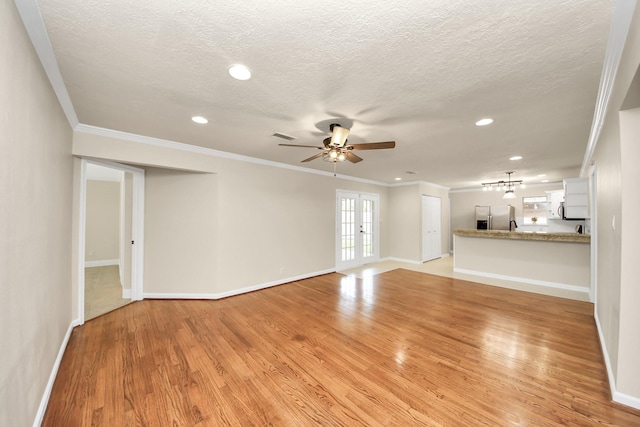 2215 Gardenia Dr, Houston, TX 77018 - unfurnished living room with crown molding, ceiling fan, light wood finished floors, recessed lighting, and a textured ceiling
