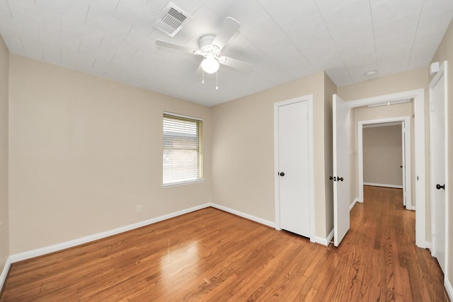 2215 Gardenia Dr, Houston, TX 77018 - unfurnished bedroom with wood finished floors and ceiling fan