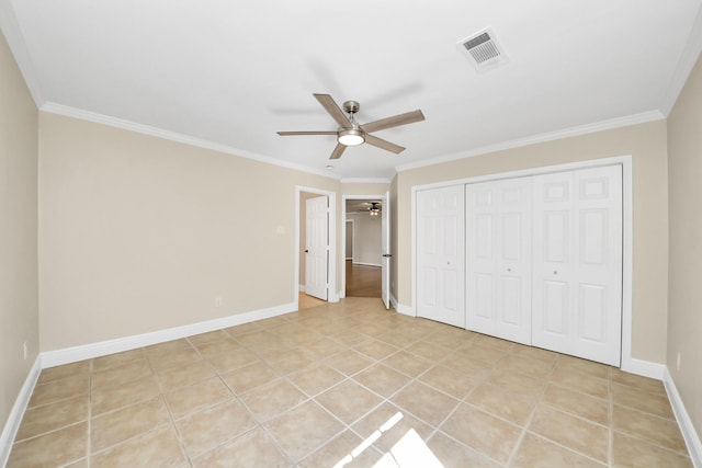 2215 Gardenia Dr, Houston, TX 77018 - unfurnished bedroom featuring crown molding, a closet, ceiling fan, and light tile patterned floors