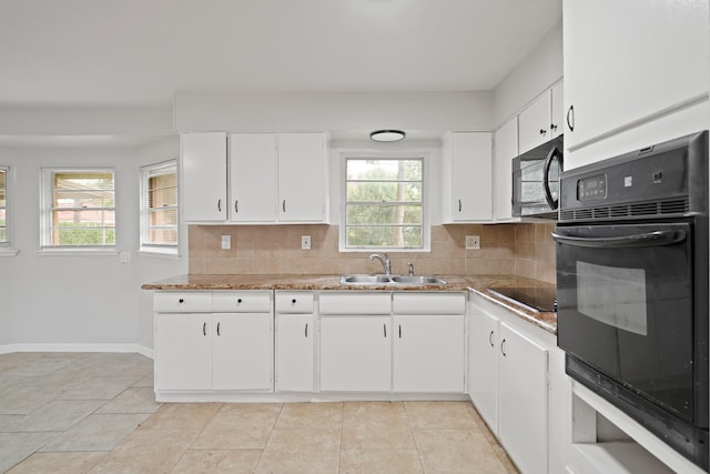 2931 Barksdale Dr, Houston, TX 77093 - kitchen featuring black appliances, decorative backsplash, white cabinetry, light tile patterned floors, and light countertops