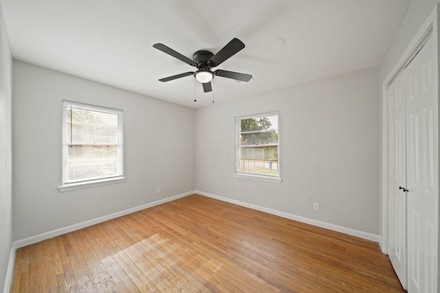 2931 Barksdale Dr, Houston, TX 77093 - unfurnished bedroom featuring a closet, light wood-style flooring, and a ceiling fan