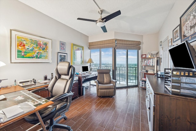 3350 Mccue Rd Unit 1504, Houston, TX 77056 - home office with a ceiling fan, dark wood-style floors, and a textured ceiling
