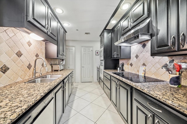 3350 Mccue Rd Unit 1504, Houston, TX 77056 - kitchen featuring white appliances, under cabinet range hood, backsplash, light stone countertops, and dark cabinets