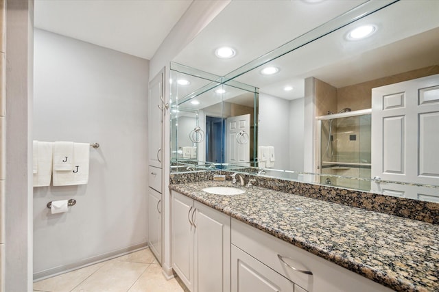 3350 Mccue Rd Unit 1504, Houston, TX 77056 - bathroom featuring tile patterned flooring, a stall shower, vanity, and recessed lighting