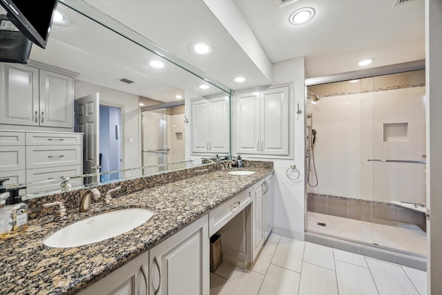 3350 Mccue Rd Unit 1504, Houston, TX 77056 - bathroom with recessed lighting, a shower stall, double vanity, and tile patterned flooring