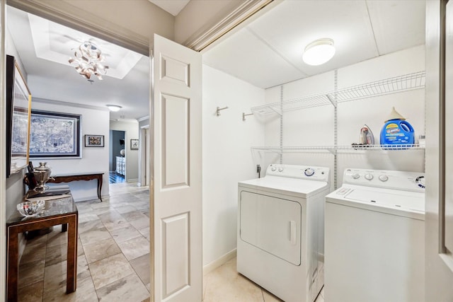 3350 Mccue Rd Unit 1504, Houston, TX 77056 - washroom with independent washer and dryer and a chandelier