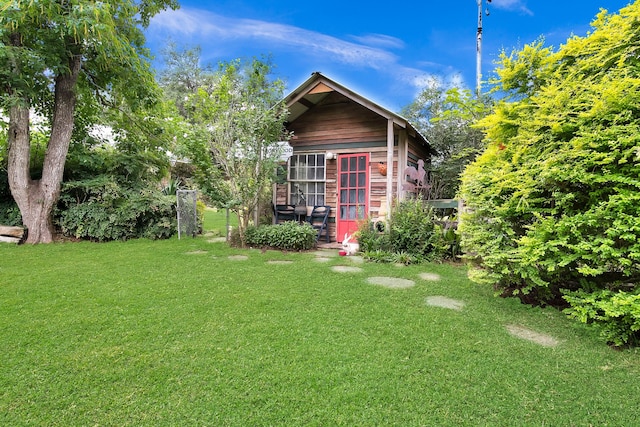 2970 Spanish Oaks Dr, Brenham, TX 77833 - back of house featuring a yard and an outbuilding