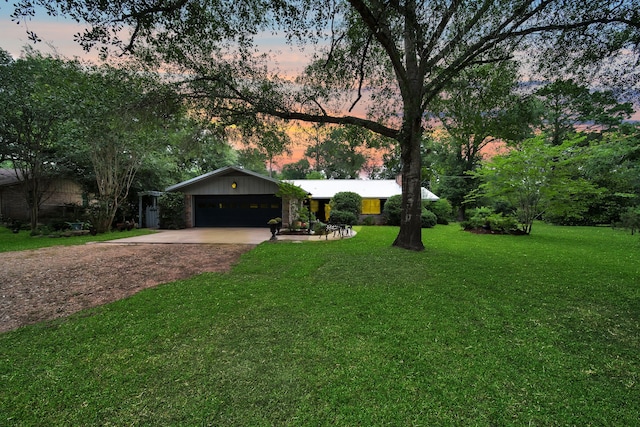 2970 Spanish Oaks Dr, Brenham, TX 77833 - view of front of home with concrete driveway, a front lawn, and a garage