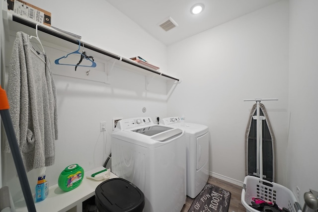 5958 First Blush Dr, Katy, TX 77493 - washroom with independent washer and dryer, wood finished floors, and recessed lighting