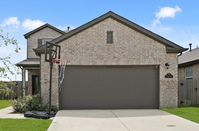 5958 First Blush Dr, Katy, TX 77493 - view of front of house with driveway, an attached garage, and brick siding