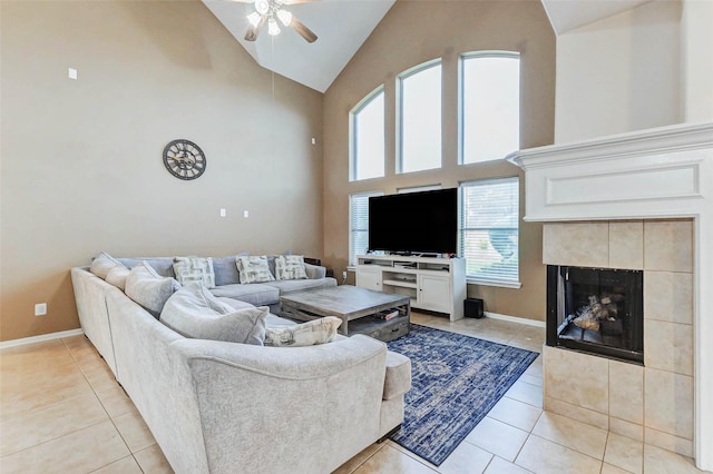 2961 Autumn Brook Ln, League City, TX 77573 - living area with a ceiling fan, light tile patterned flooring, high vaulted ceiling, and a tiled fireplace