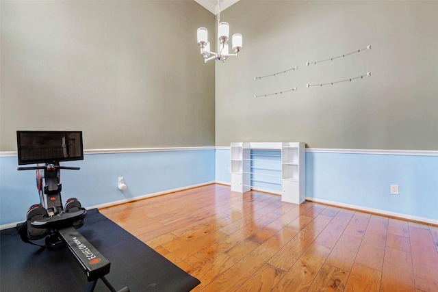2961 Autumn Brook Ln, League City, TX 77573 - workout area featuring hardwood / wood-style flooring and a chandelier