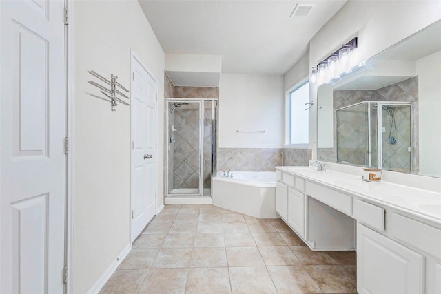 2961 Autumn Brook Ln, League City, TX 77573 - bathroom featuring a bath, a shower stall, double vanity, and tile patterned flooring