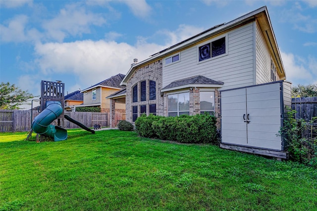 2961 Autumn Brook Ln, League City, TX 77573 - rear view of house with a playground