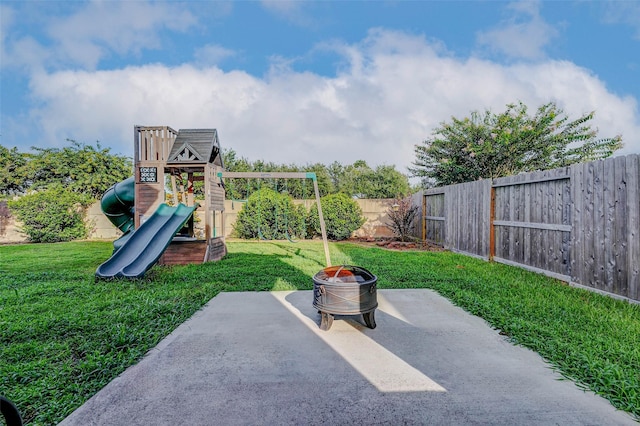 2961 Autumn Brook Ln, League City, TX 77573 - fenced backyard with a playground, a patio, and a fire pit