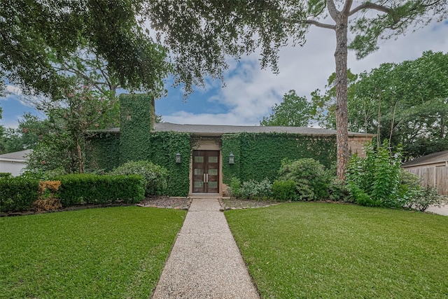 11914 Ashmead Dr, Houston, TX 77077 - mid-century inspired home featuring french doors and a front yard