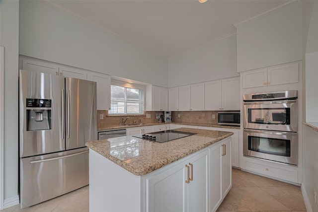 11914 Ashmead Dr, Houston, TX 77077 - kitchen with appliances with stainless steel finishes, ornamental molding, light tile patterned floors, and backsplash