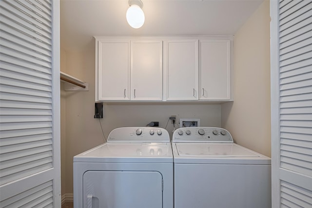 11914 Ashmead Dr, Houston, TX 77077 - laundry area with washing machine and dryer and cabinet space